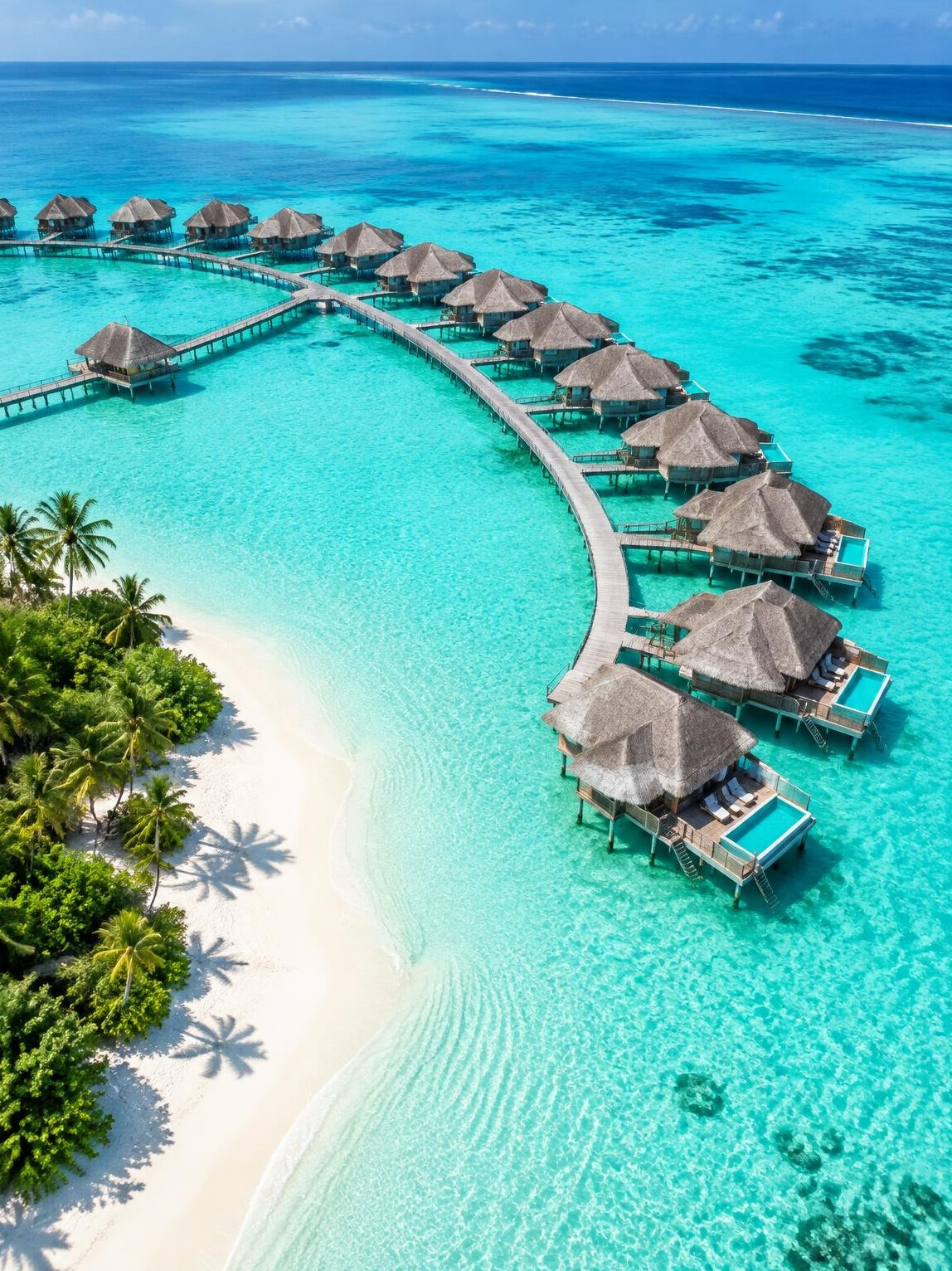 Overwater villas above a turquoise lagoon in the Maldives